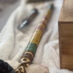 The Vietnam Veterans of America (VVA) flag and related insignia use specific colors to honor and remember the conflict. The flag features a golden yellow background, mirroring the color of the flag of the Republic of Vietnam and the Vietnam Service Medal ribbon. Seventeen brown stars represent the seventeen official campaigns of the Vietnam War. The VVA insignia is centered on the flag, incorporating the service ribbon design and a wreath with a laurel branch and rice stalks, tied with black barbed wire, symbolizing Southeast Asia, honor, and the POWs/MIAs.  The Vietnam Service Medal ribbon, another key element, is green, yellow, and red, with the yellow representing the gold of the Republic of Vietnam flag. The other colors (red and green) are also present in the Vietnam Service Medal ribbon, according to the Vietnam War Commemoration website. The colors of the flag and ribbons are used across various Vietnam War commemoration materials, such as the official seal, to maintain consistency and honor the service members. 